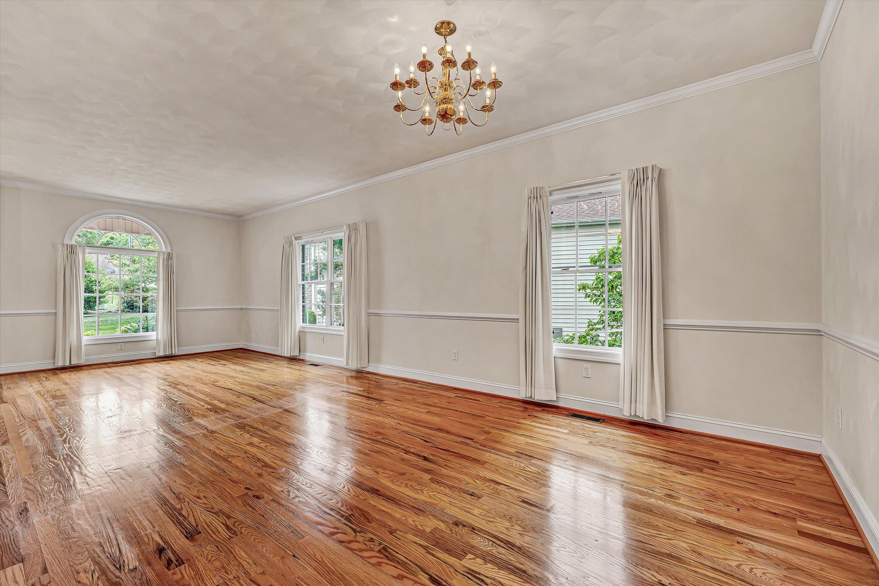 131 Stoney Mill Road Rocky Mount, VA 24151 - Photo 16 of 37 a view of empty room with wooden floor and fan