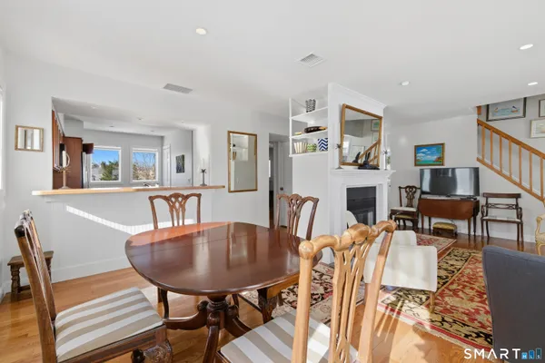a view of a dining room with furniture and a livingroom