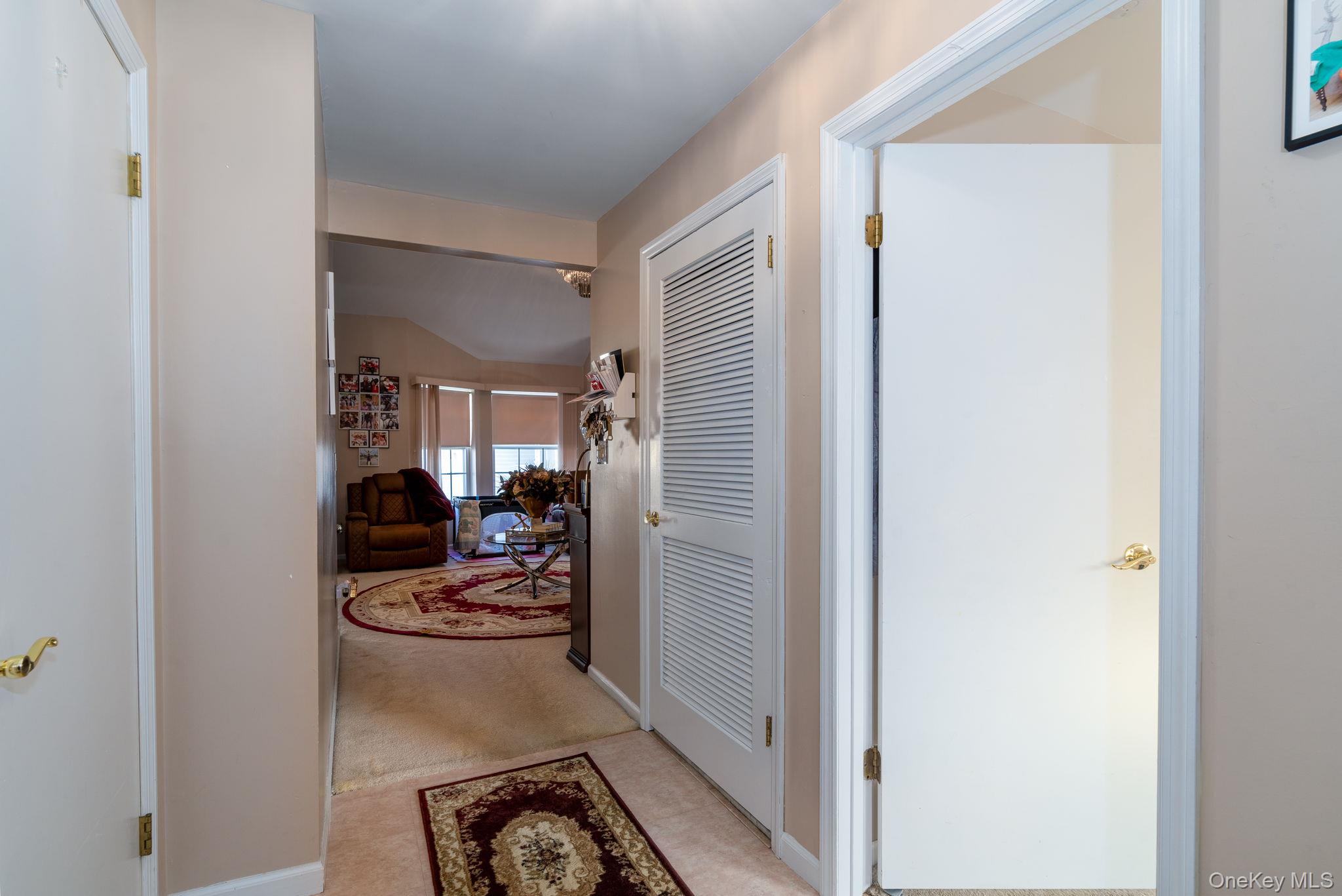 205 Ramapo Road, Unit H Garnerville, NY 10923 - Photo 11 of 31 a view of a hallway with dining area and living room