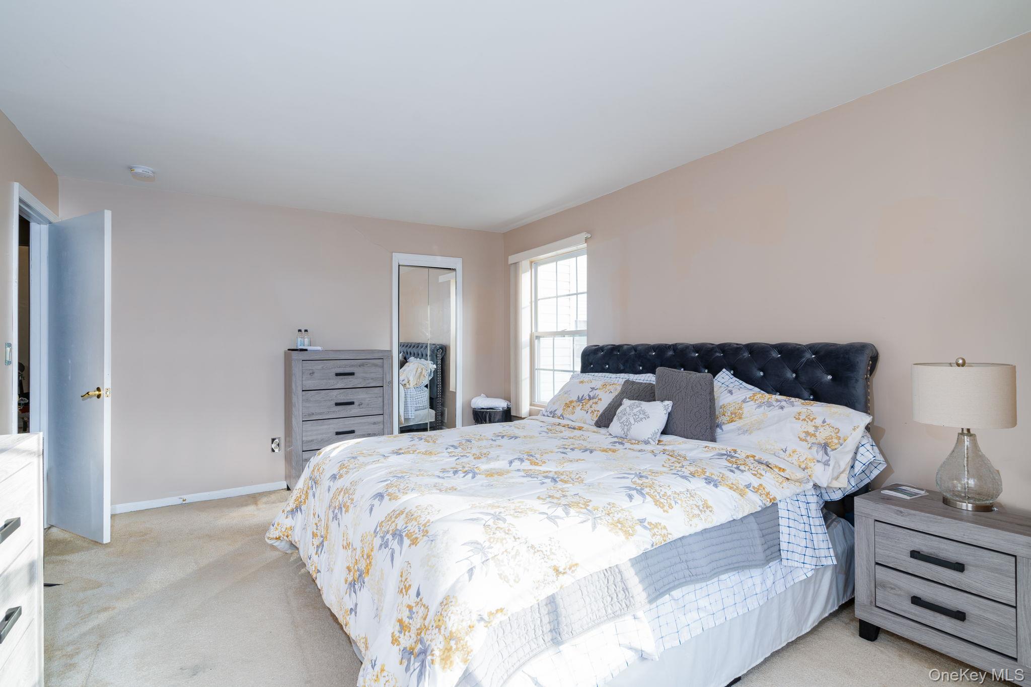 205 Ramapo Road, Unit H Garnerville, NY 10923 - Photo 13 of 31 a bedroom with bed and dresser