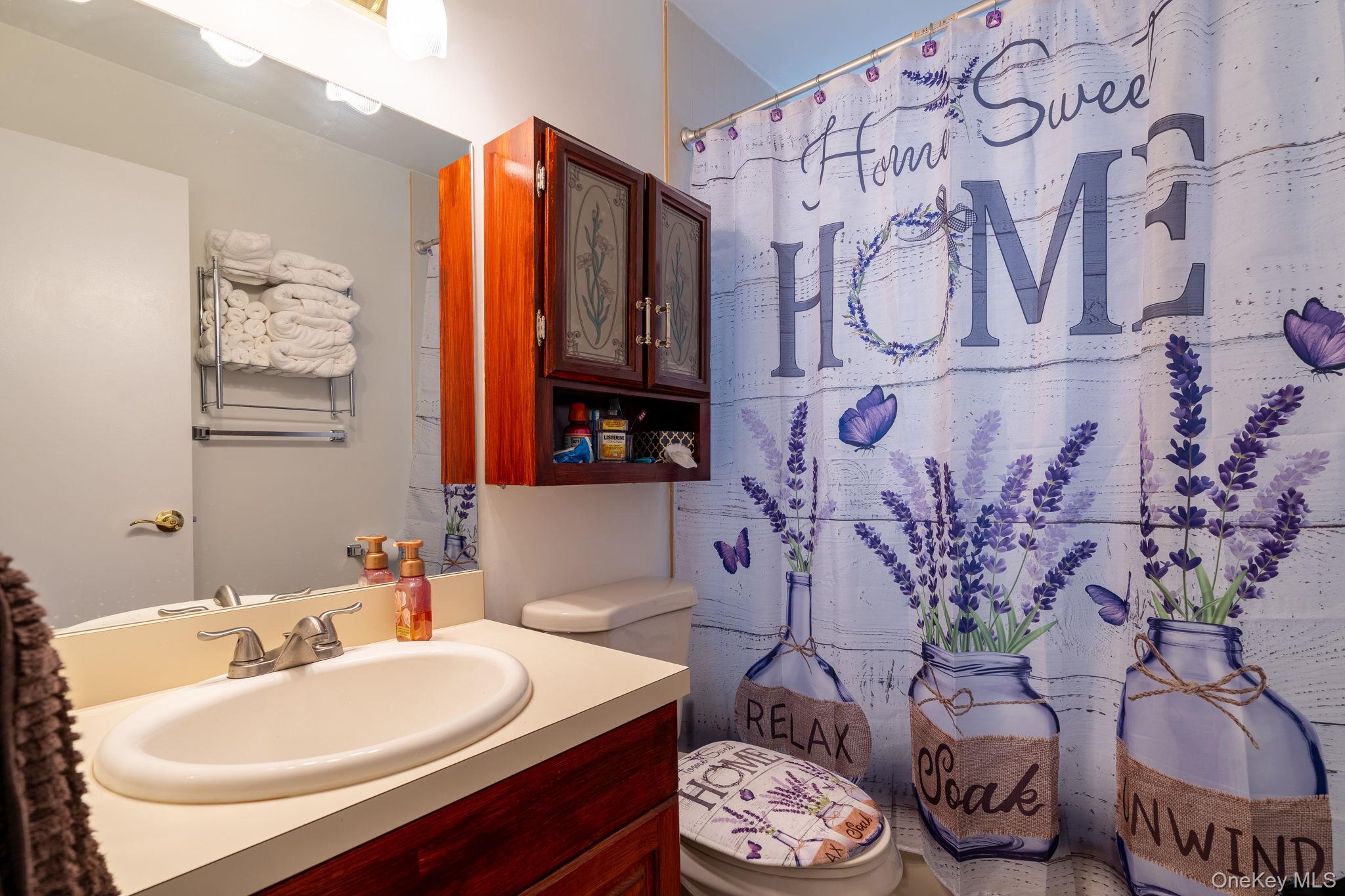 205 Ramapo Road, Unit H Garnerville, NY 10923 - Photo 15 of 31 a bathroom with a sink and a mirror