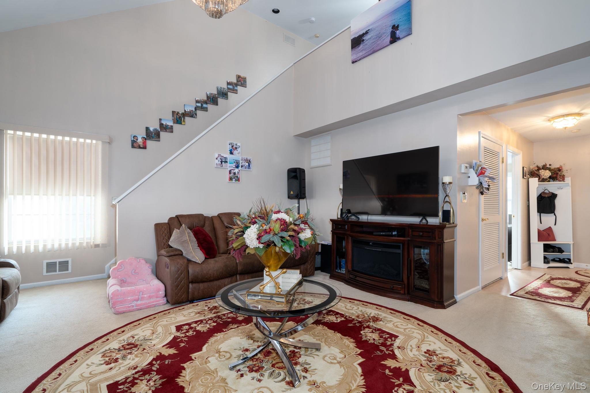 205 Ramapo Road, Unit H Garnerville, NY 10923 - Photo 17 of 31 a living room with furniture and a flat screen tv