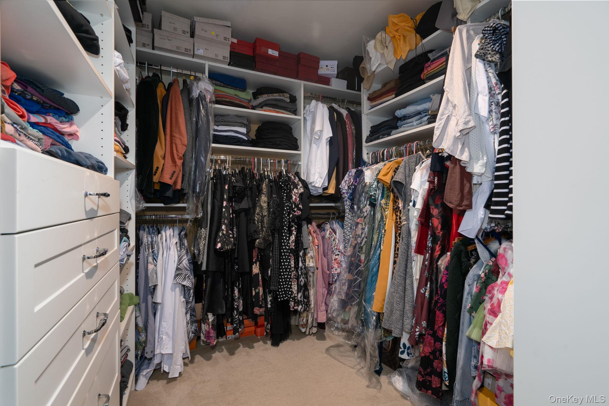 205 Ramapo Road, Unit H Garnerville, NY 10923 - Photo 21 of 31 a view of walk in closet with clothes and shoes