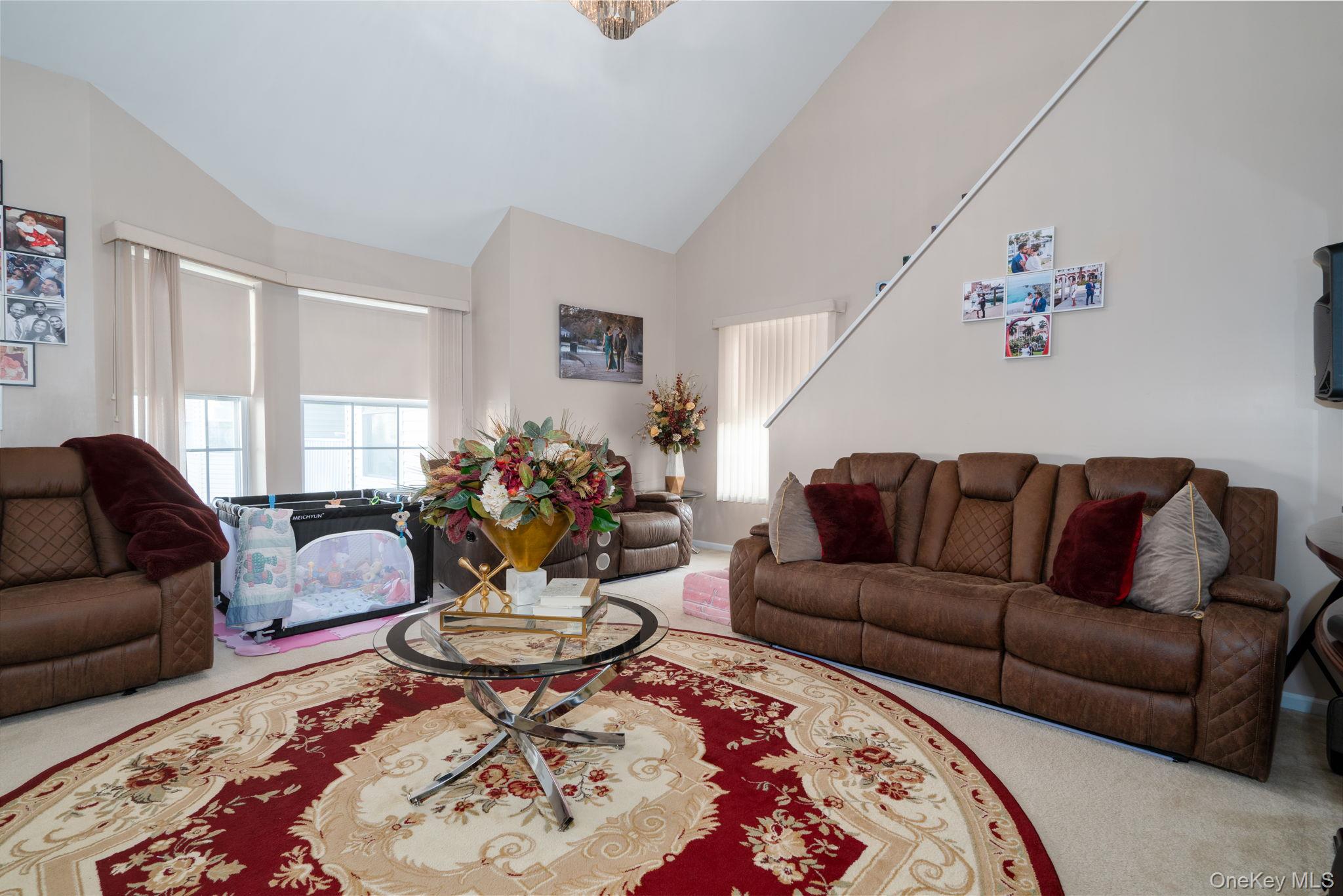 205 Ramapo Road, Unit H Garnerville, NY 10923 - Photo 3 of 31 a living room with furniture and a dining table