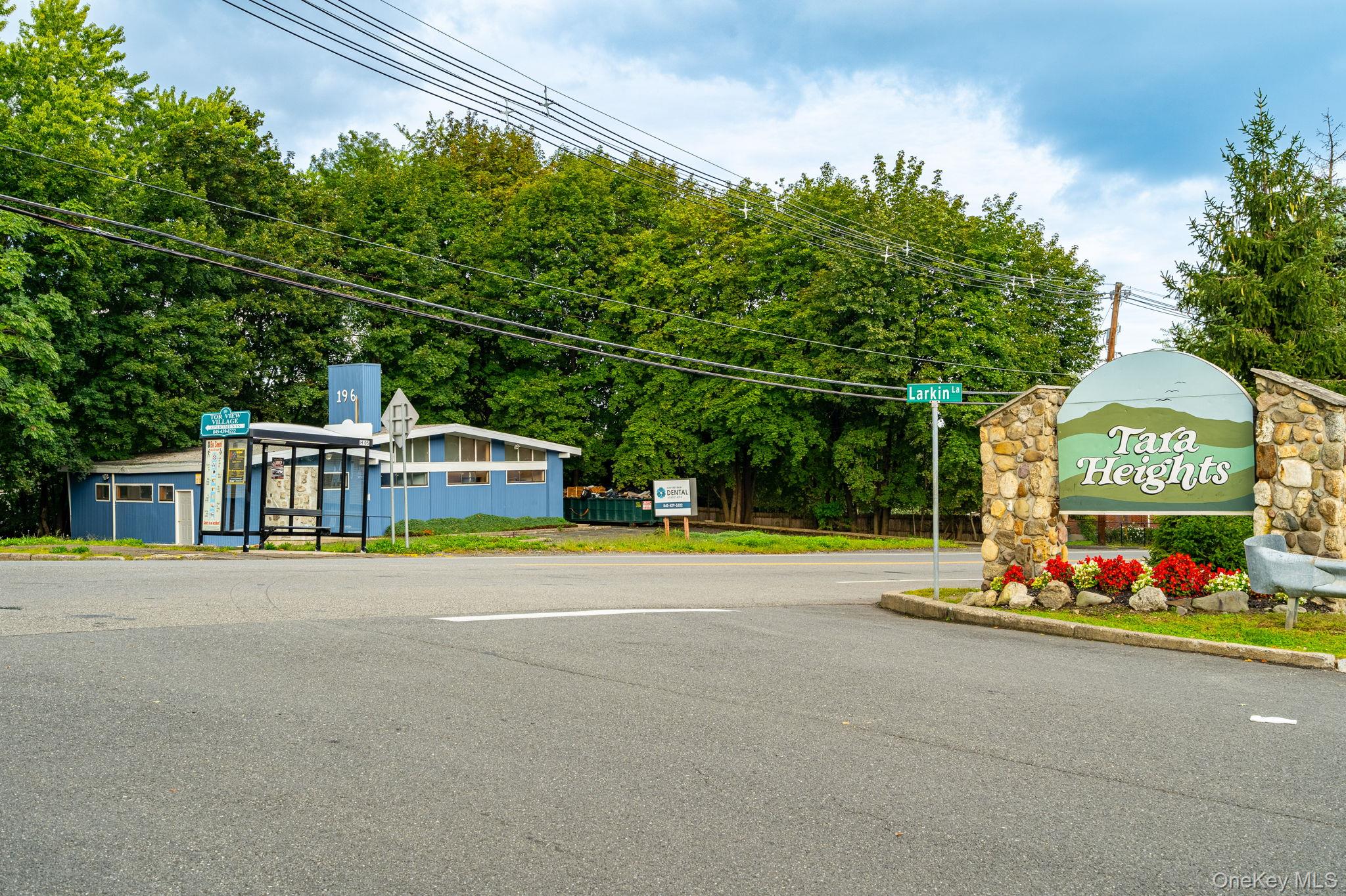 205 Ramapo Road, Unit H Garnerville, NY 10923 - Photo 31 of 31 a front view of a house with a garden and tree s