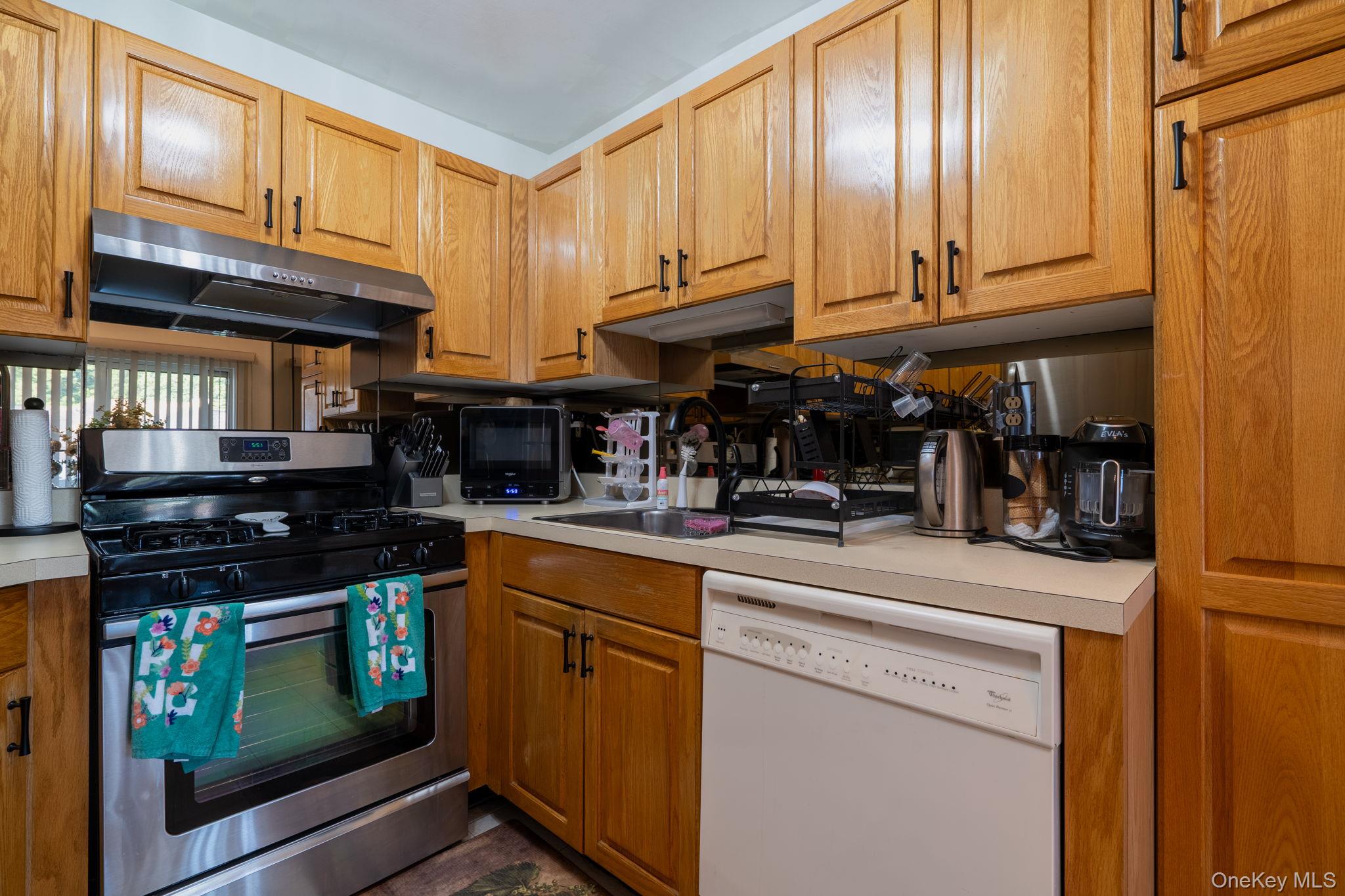 205 Ramapo Road, Unit H Garnerville, NY 10923 - Photo 8 of 31 a kitchen with stainless steel appliances granite countertop a stove and cabinets