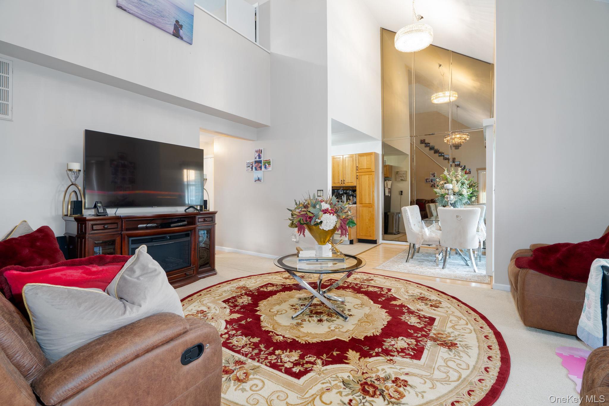 205 Ramapo Road, Unit H Garnerville, NY 10923 - Photo 10 of 31 a living room with furniture and a flat screen tv