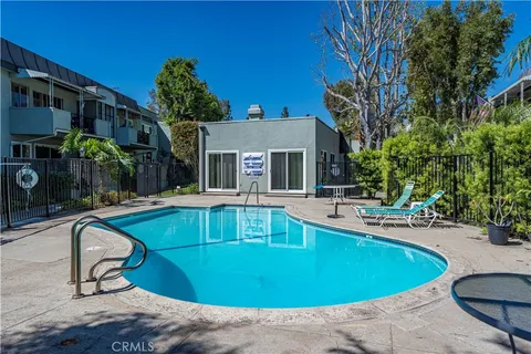a view of a house with swimming pool