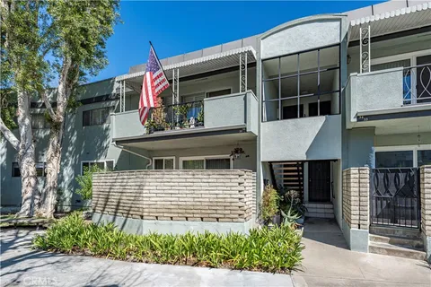 a side view of a house with a yard