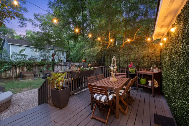 a view of a chairs and table in backyard of the house