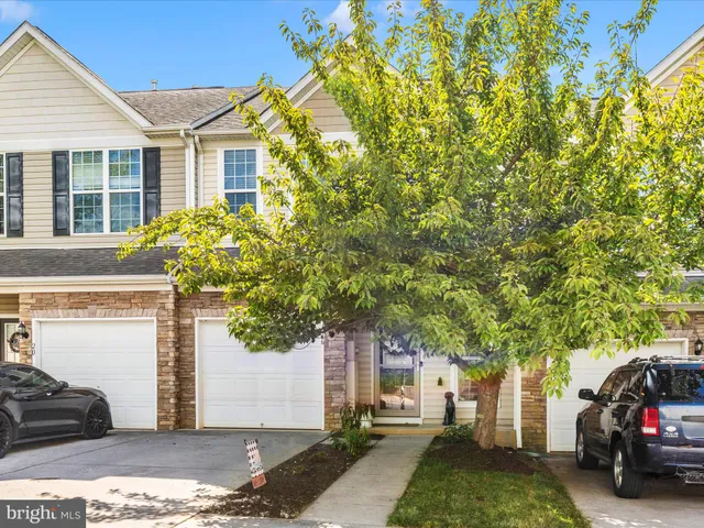 a view of a car parked in front of a house