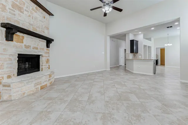 a view of kitchen with sink microwave and cabinets