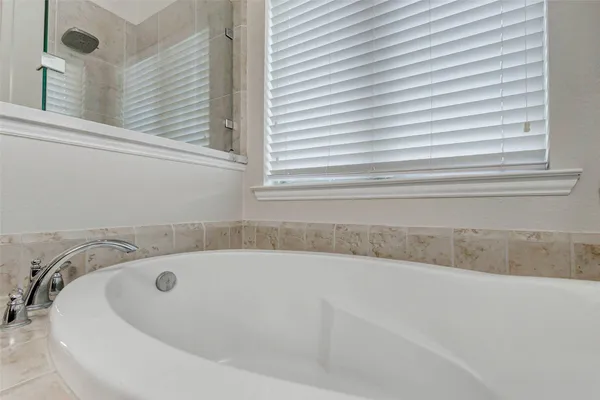 a large kitchen with cabinets and stainless steel appliances