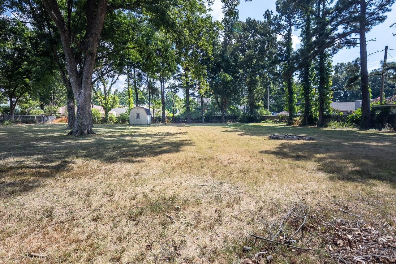 2718 Kate Bond Road Memphis, TN 38133 - Photo 30 of 39 View of yard with a shed and view of scattered trees