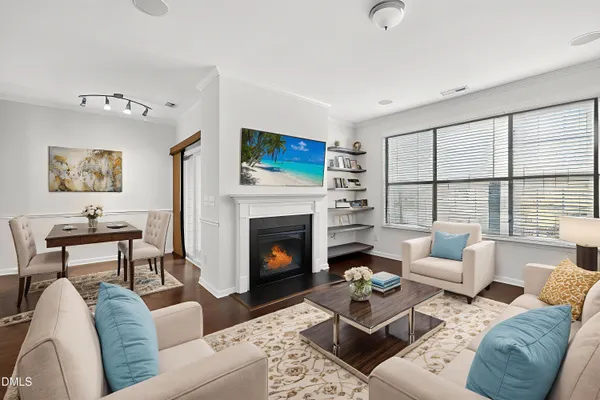 a kitchen with kitchen island a counter top space cabinets and stainless steel appliances