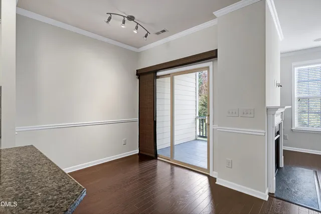 a kitchen with stainless steel appliances granite countertop a sink refrigerator and microwave