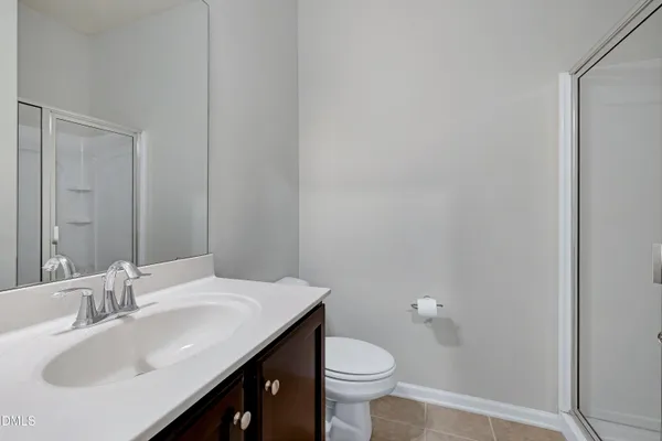 a water heater room with a chair