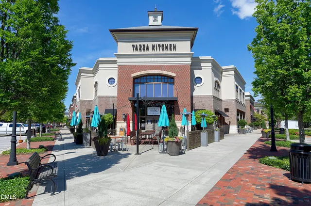 a front view of a house with yard