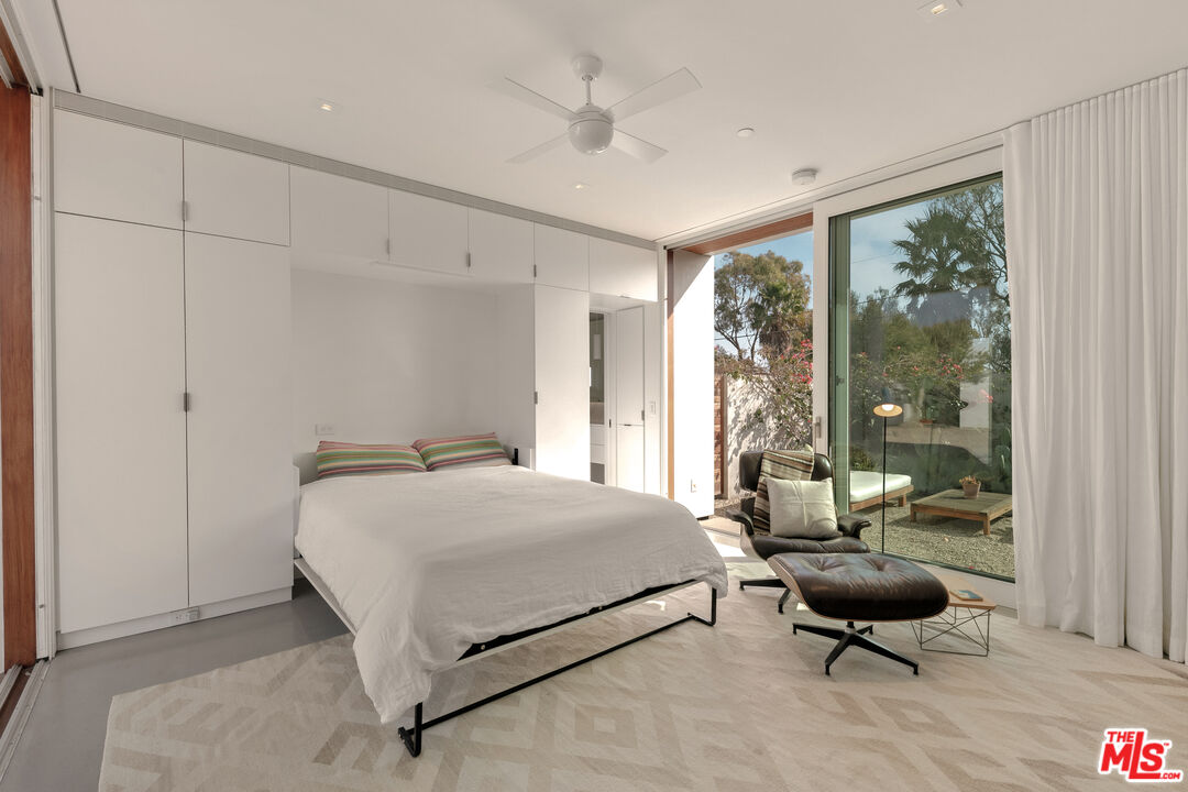 6728 Wildlife Road Malibu, CA 90265 - Photo 27 of 57 a bedroom with a bed and a couch