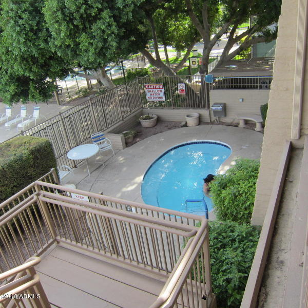 5500 South Rocky Point Road Tempe, AZ 85283 - Photo 54 of 69 a view of balcony with wooden floor and outdoor seating
