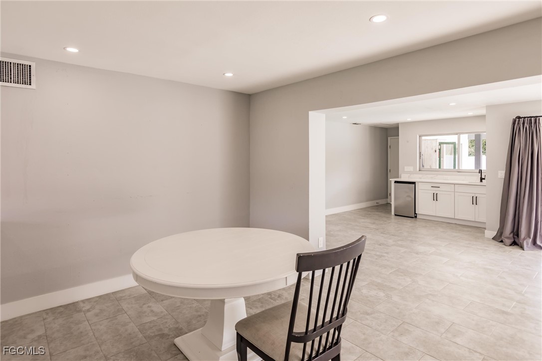 905 Dean Way Fort Myers, FL 33919 - Photo 13 of 43 a view of a kitchen and an empty room