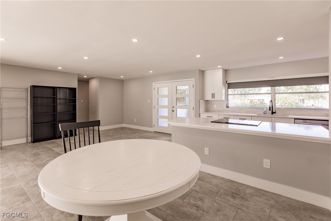 905 Dean Way Fort Myers, FL 33919 - Photo 15 of 43 a large white kitchen with a large window