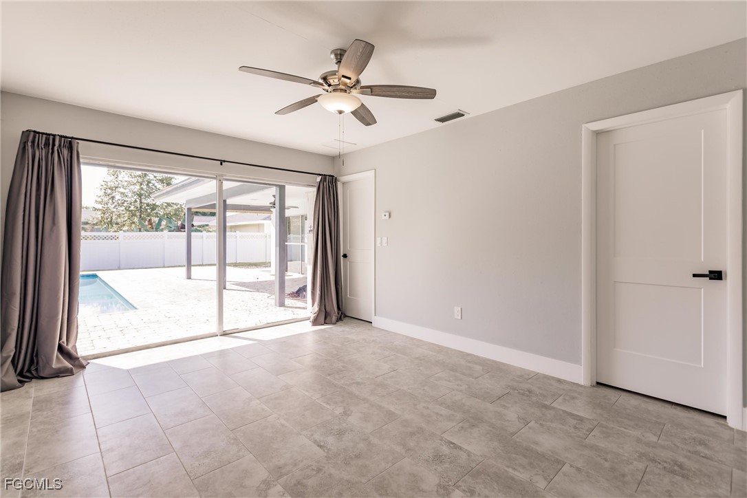 905 Dean Way Fort Myers, FL 33919 - Photo 22 of 43 a view of an empty room with a window