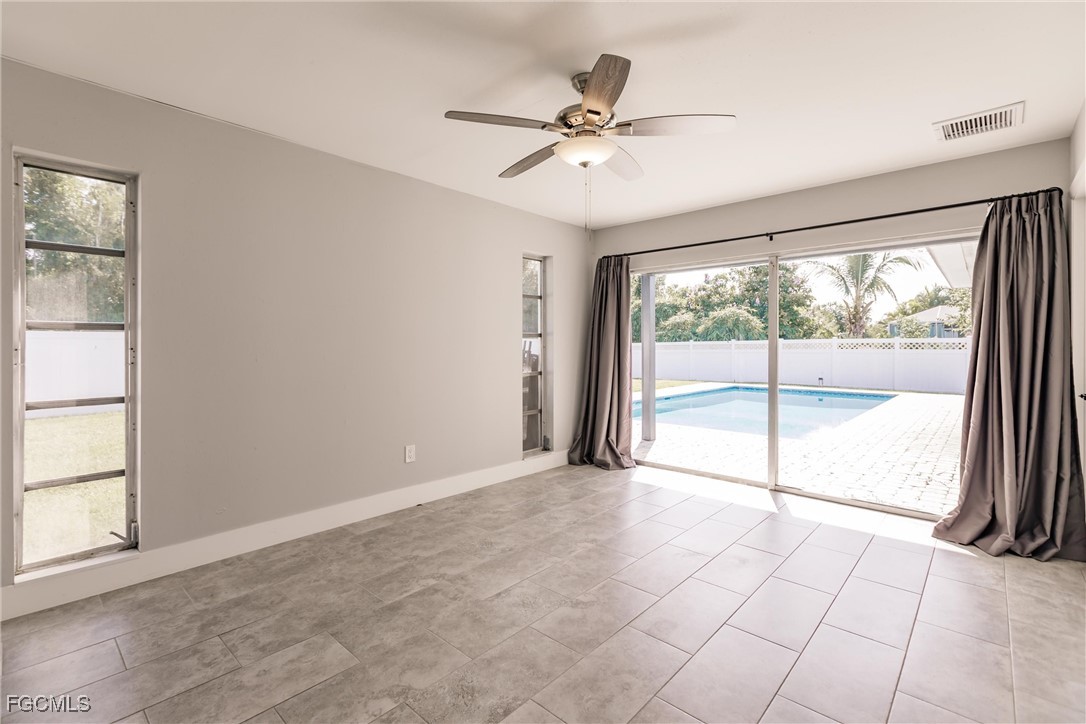 905 Dean Way Fort Myers, FL 33919 - Photo 23 of 43 a view of an empty room with a window