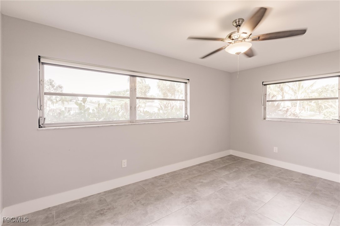905 Dean Way Fort Myers, FL 33919 - Photo 26 of 43 a view of an empty room with a window
