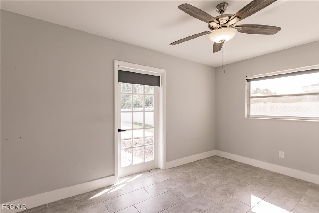 905 Dean Way Fort Myers, FL 33919 - Photo 30 of 43 an empty room with windows and fan