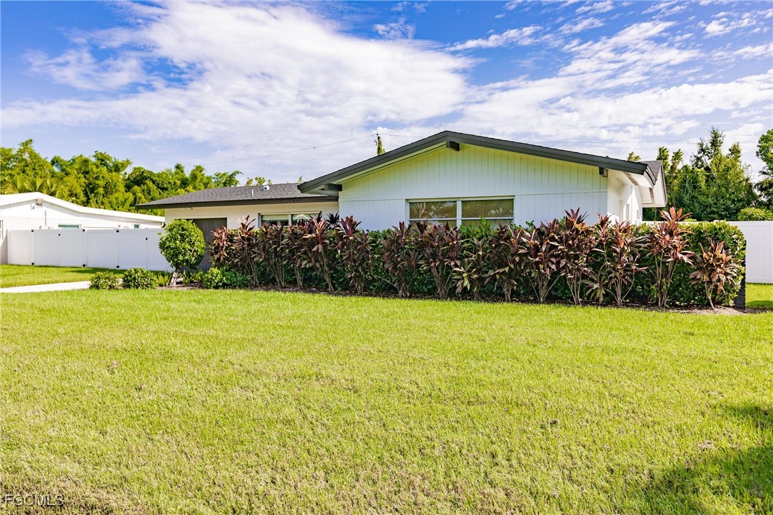 905 Dean Way Fort Myers, FL 33919 - Photo 3 of 43 a view of a house with a yard and potted plants