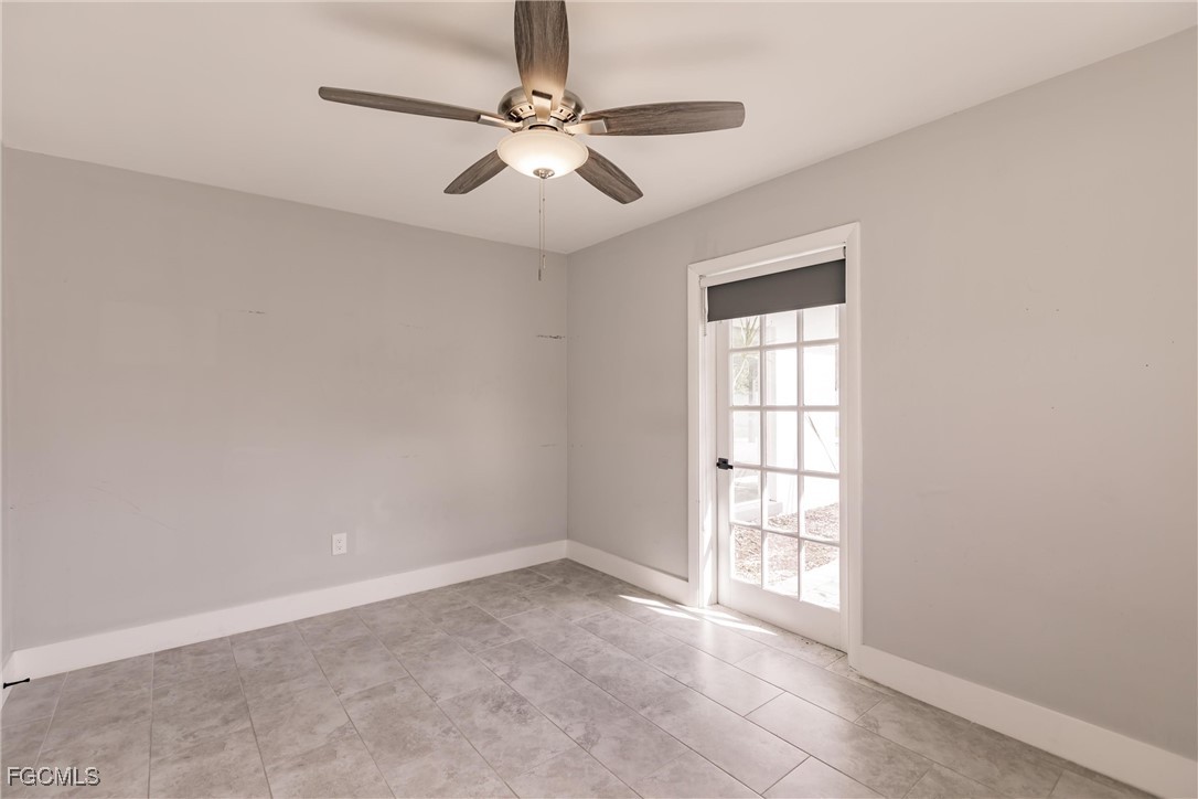 905 Dean Way Fort Myers, FL 33919 - Photo 31 of 43 an empty room with windows and fan