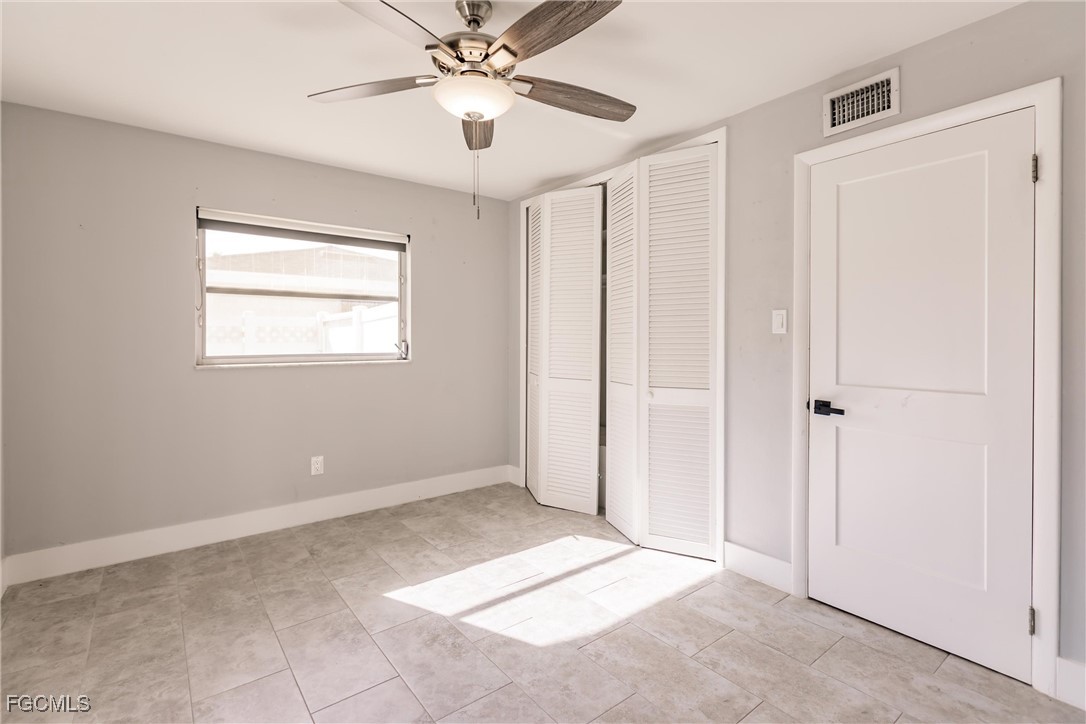 905 Dean Way Fort Myers, FL 33919 - Photo 32 of 43 a view of an empty room with a window