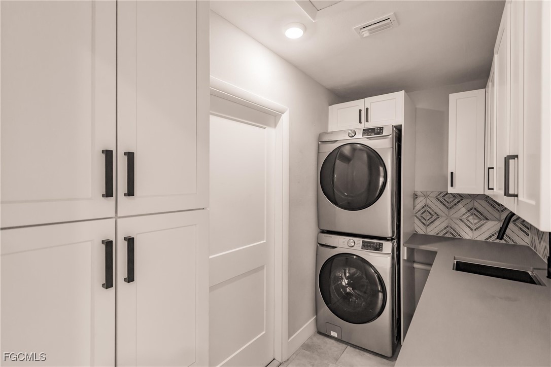 905 Dean Way Fort Myers, FL 33919 - Photo 34 of 43 a utility room with sink dryer and washer