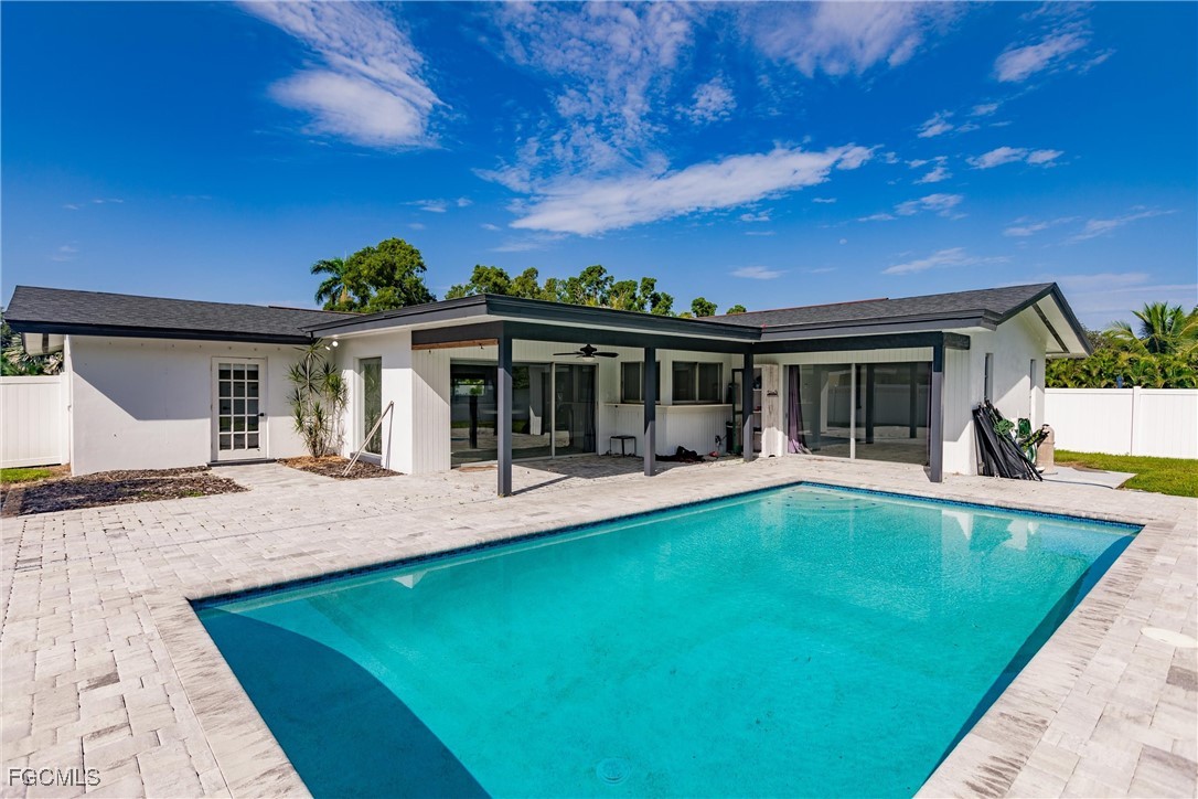 905 Dean Way Fort Myers, FL 33919 - Photo 39 of 43 a view of house with swimming pool and seating space