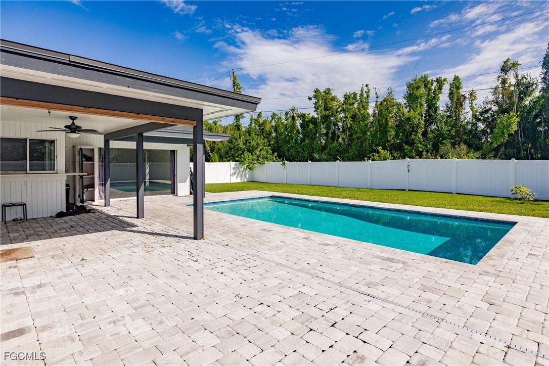 905 Dean Way Fort Myers, FL 33919 - Photo 40 of 43 a view of a swimming pool with an outdoor seating