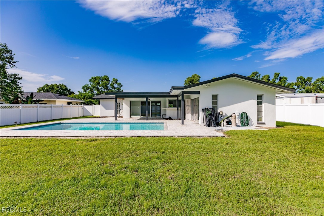 905 Dean Way Fort Myers, FL 33919 - Photo 42 of 43 a view of house and outdoor space with swimming pool