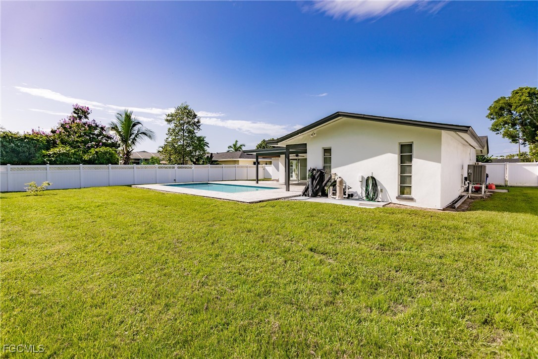 905 Dean Way Fort Myers, FL 33919 - Photo 43 of 43 a front view of a house with a yard