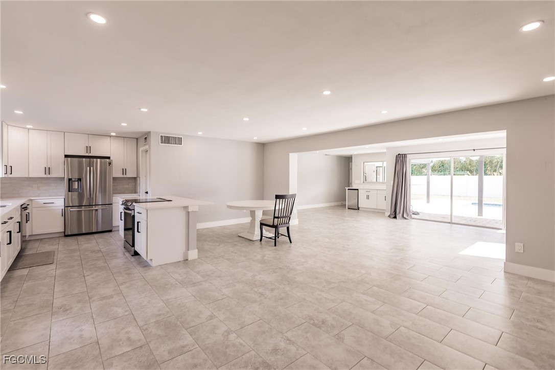 905 Dean Way Fort Myers, FL 33919 - Photo 6 of 43 a view of kitchen with furniture and refrigerator