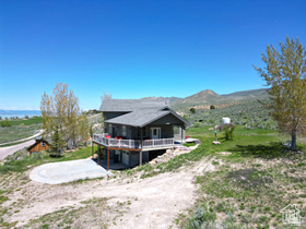 1940 East Shore Road St. Charles, ID 83272 - Photo 48 of 64 Rear view of house featuring a mountain view and a view of countryside