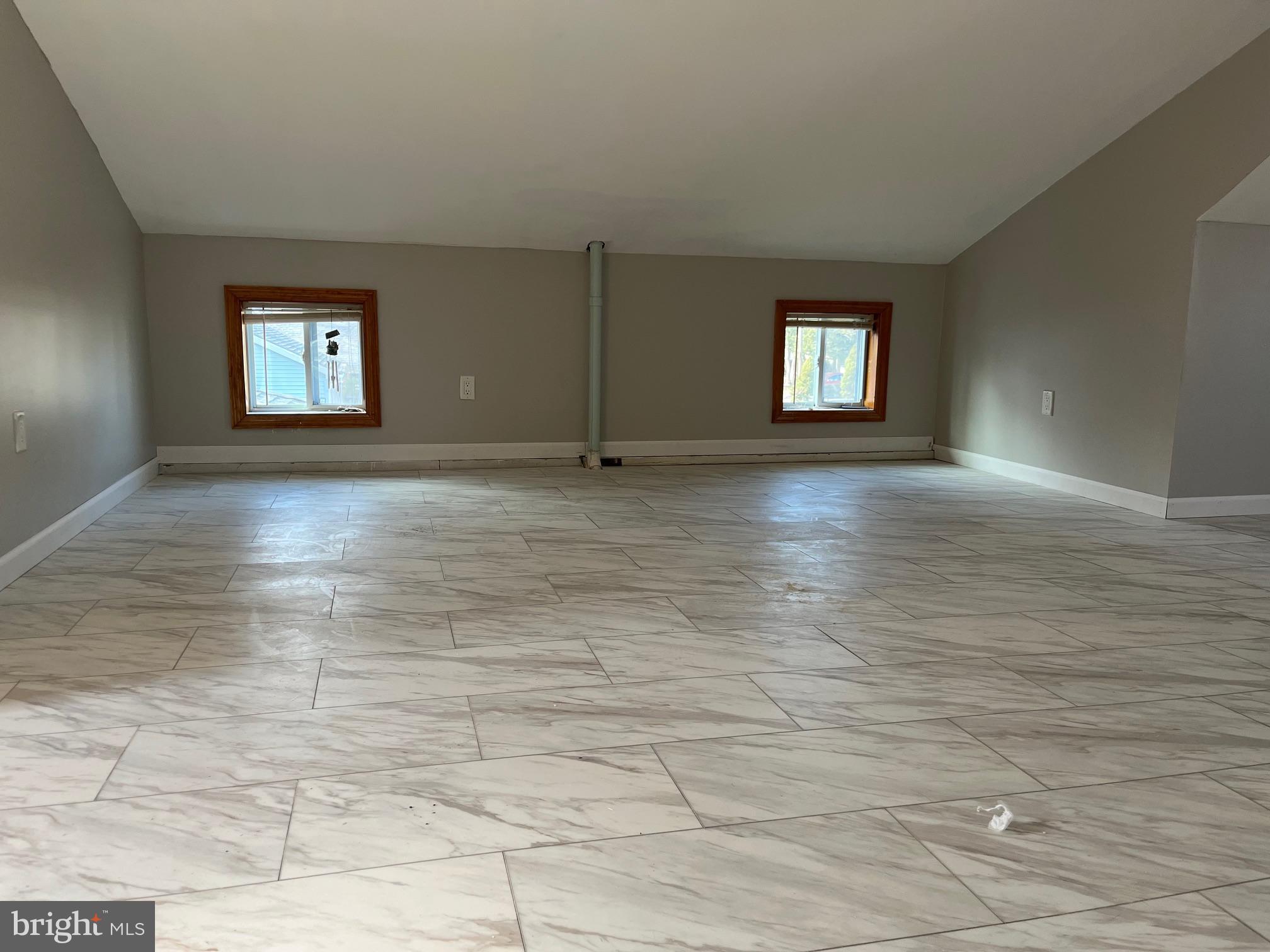 112 1st Avenue Tuckerton, NJ 08087 - Photo 5 of 6 a view of an empty room and window