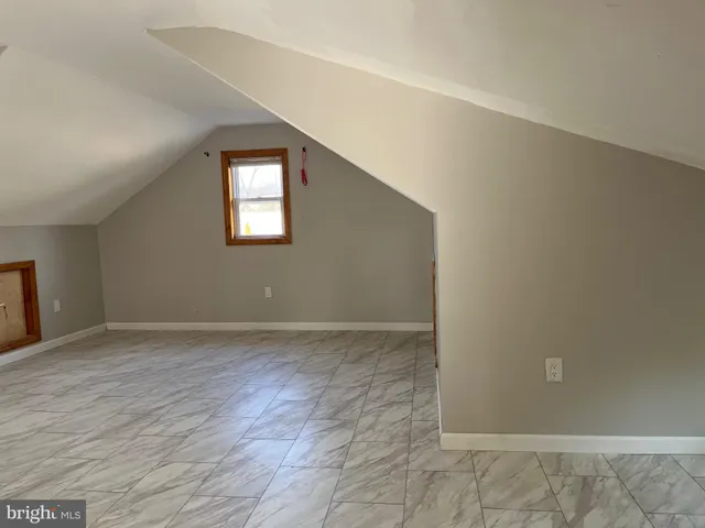 an empty room with a empty space and window