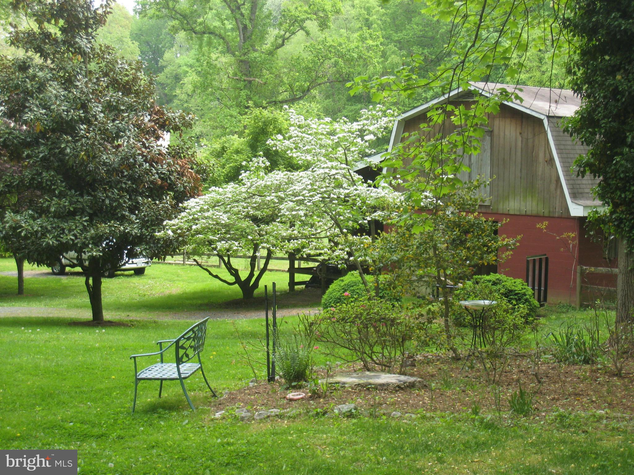 985 Chesterfield Road Annapolis, MD 21401 - Photo 3 of 30 a green field with some trees in the background