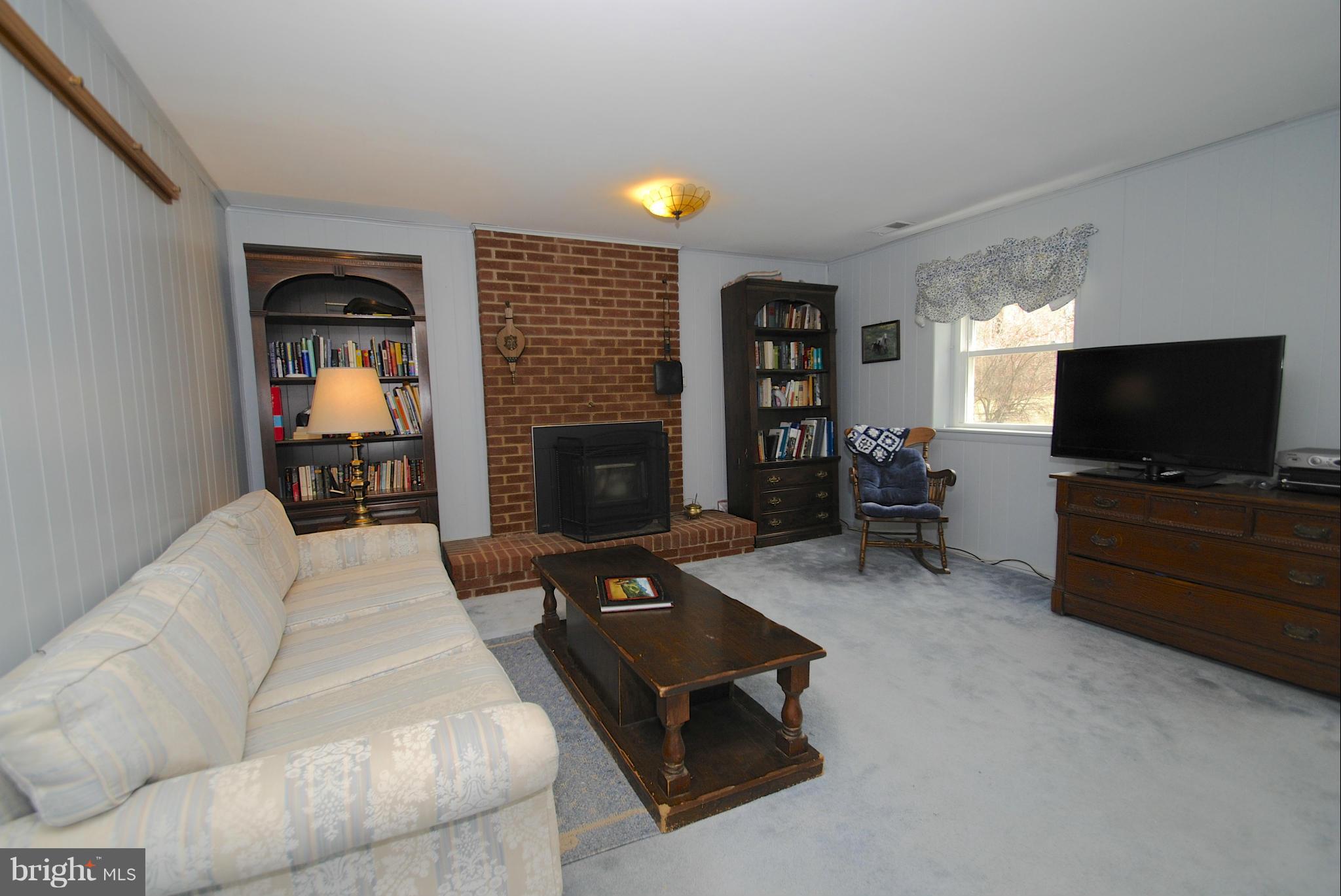 985 Chesterfield Road Annapolis, MD 21401 - Photo 22 of 30 a living room with furniture and a flat screen tv