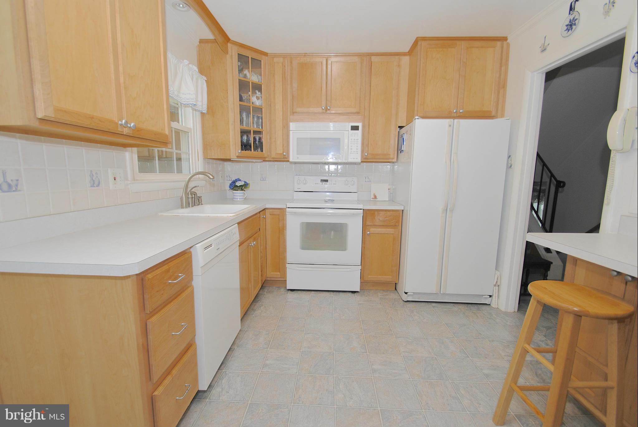 985 Chesterfield Road Annapolis, MD 21401 - Photo 10 of 30 a kitchen with stainless steel appliances a stove a sink a refrigerator a cabinets and a counter top space