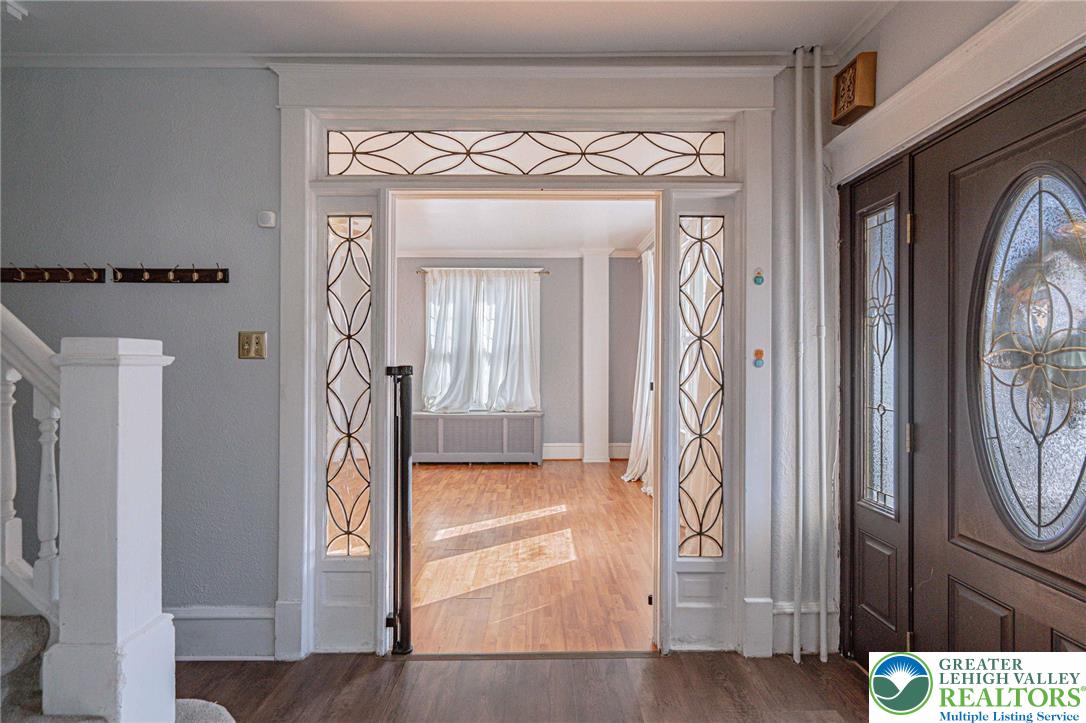 451 East Broad Street Tamaqua, PA 18252 - Photo 11 of 66 a view of a hallway with wooden floor and staircase