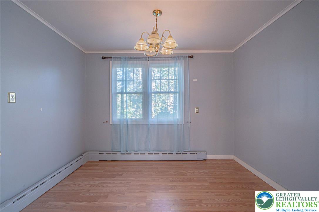 451 East Broad Street Tamaqua, PA 18252 - Photo 15 of 66 wooden floor in an empty room with a window