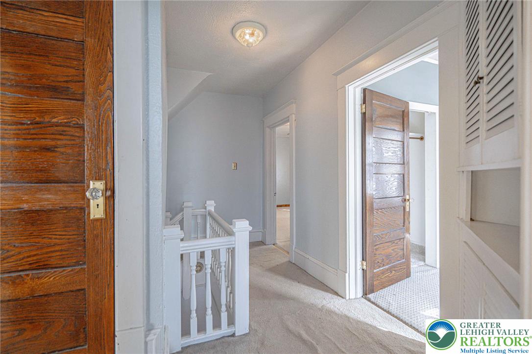 451 East Broad Street Tamaqua, PA 18252 - Photo 29 of 66 a view of a hallway to rooms and stairs