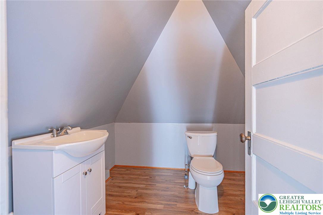 451 East Broad Street Tamaqua, PA 18252 - Photo 43 of 66 a bathroom with a sink a toilet and a mirror