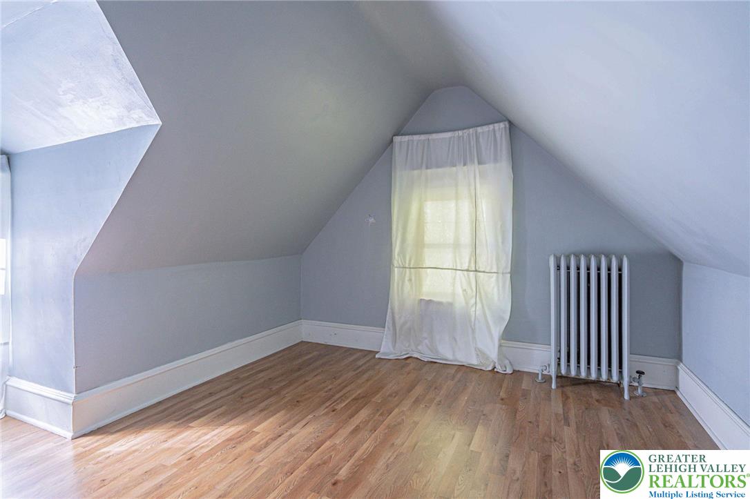 451 East Broad Street Tamaqua, PA 18252 - Photo 45 of 66 an empty room with wooden floor and windows